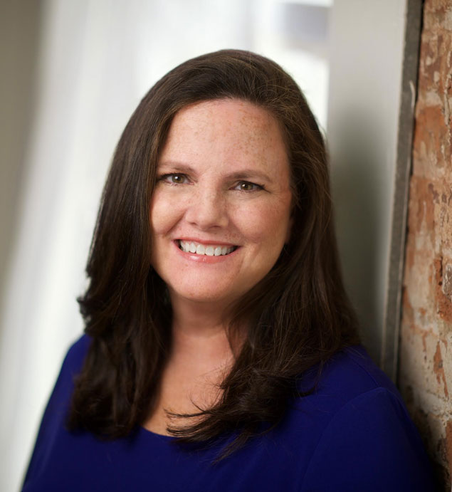 Woman smiling for a profile photo.