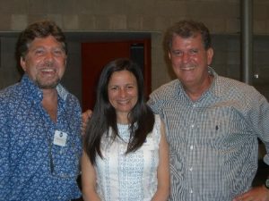 Two men and a woman posing for a conference photo.